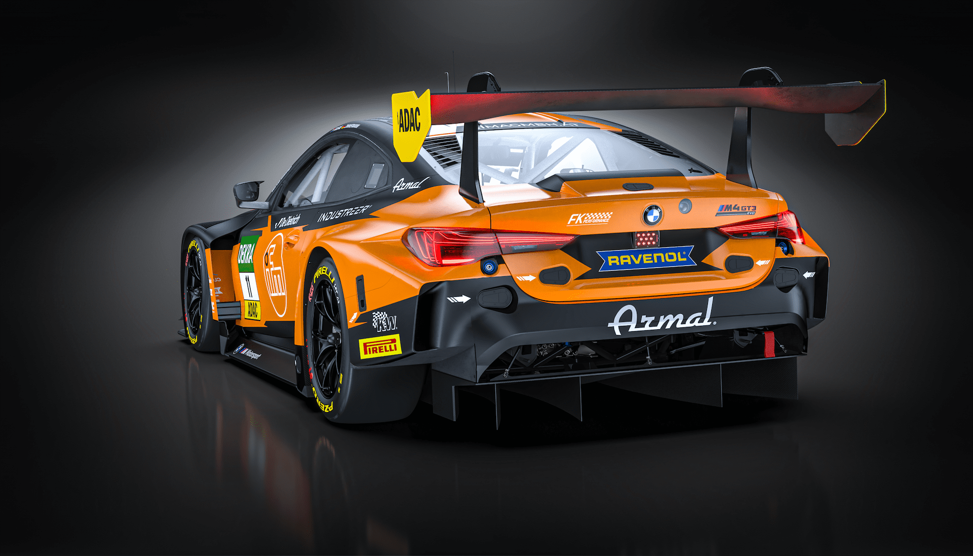 Heckansicht des orange-schwarzen BMW M4 GT3 von FK Performance Motorsport, zeigt Heckflügel und Diffusor.